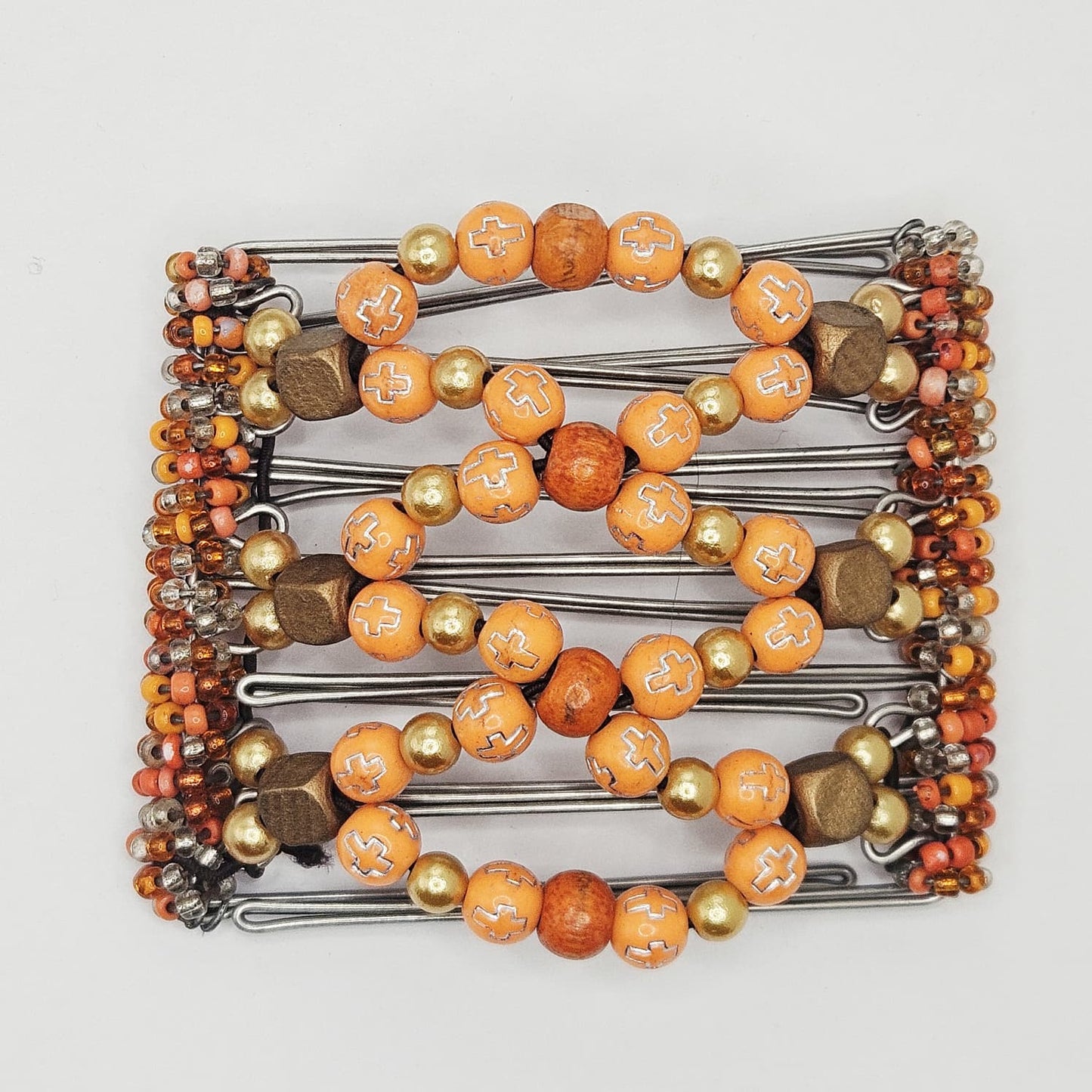 7 Tooth medium Hair comb, Orange and bronze, silver cross accents
