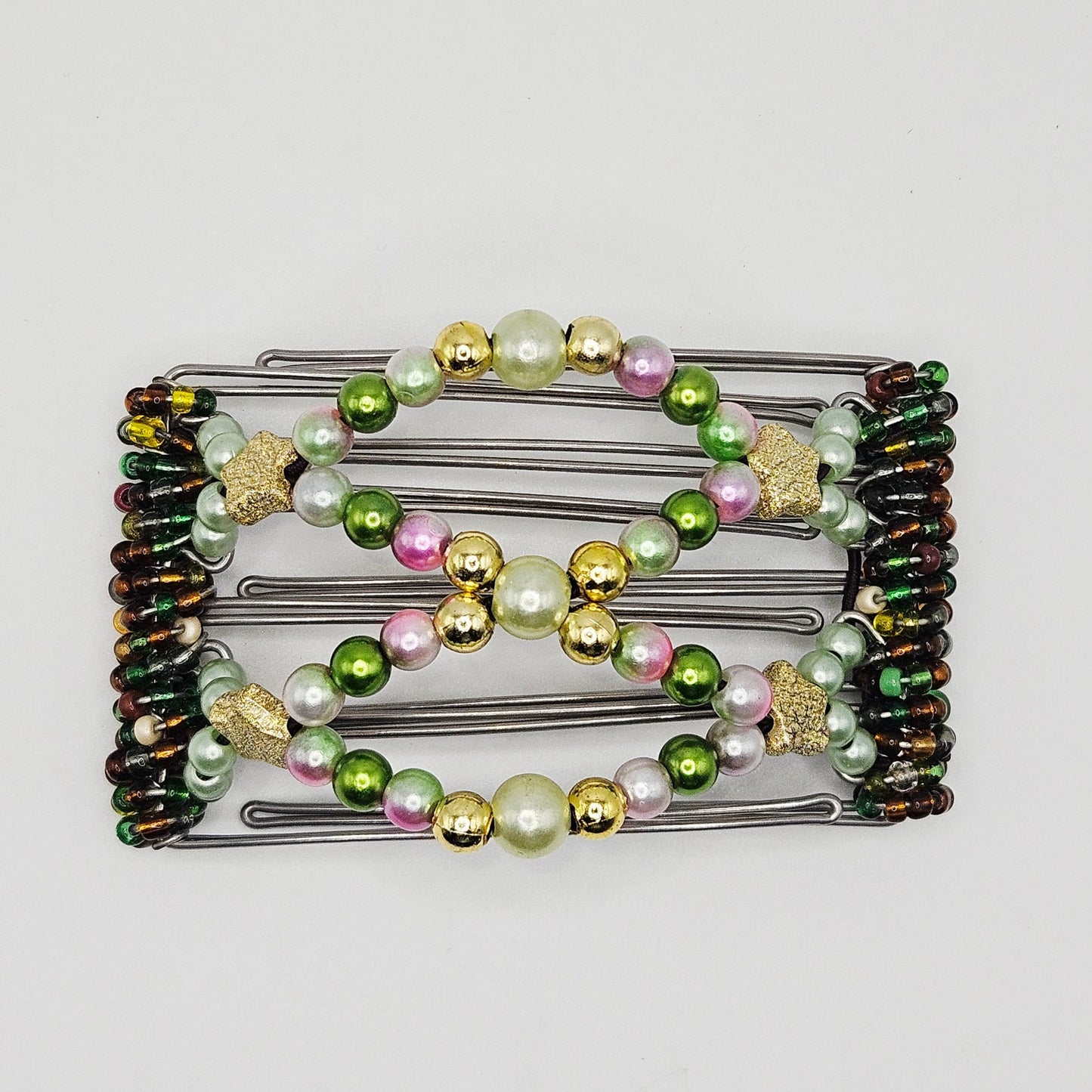 5 Tooth Small hair comb by The Hair Jeweler Inc., Shiney and whimsical, golds ,greens, pinks, golden stars