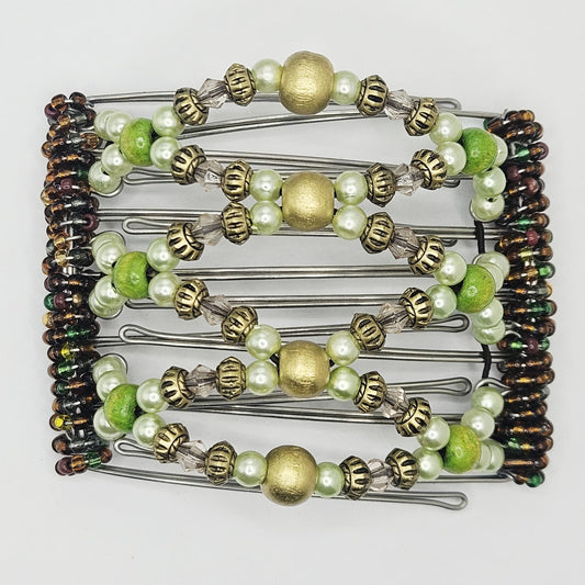 7 Tooth medium Hair comb, Ornamental golds and mixed shades of greens,