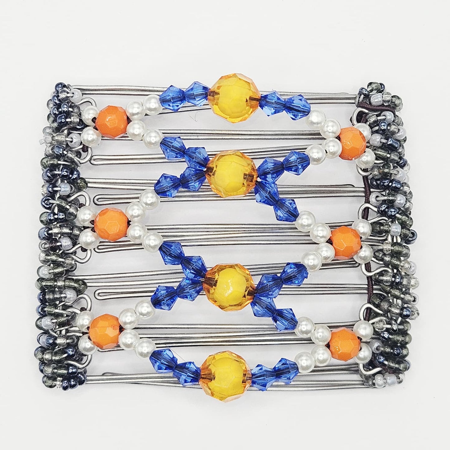 7 Tooth medium Hair comb, Orange, blue and white 3D centre