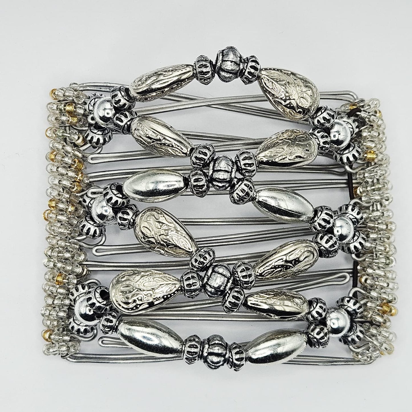 7-Tooth Medium hair comb, Silver tone ornamental design